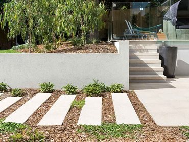 Anston's pavers contrast beautifully with foliage to create an element of softness