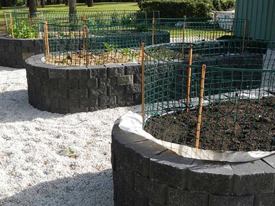 Grey masonry blocks around garden edging