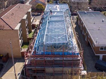 Steel roof truss at Pine Ave Townhouse project