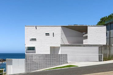 white orthogonal residential house by the sea