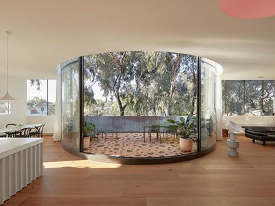 Living room interior with curved glass balcony