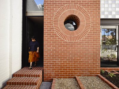 residential entrance cirlce window red brick wall