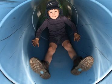 Max Marriot playing in the slide