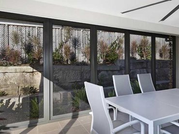 Ausiport constructed an Invisi-Gard stainless steel security screen enclosure around the living area