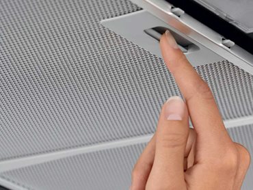 Pull the tab to remove the filters from the rangehood 