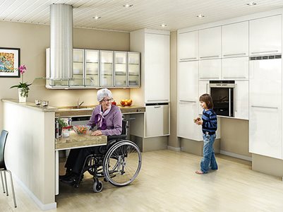 Elderly Woman in Wheelchair Cooking in Accessible Residential Kitchen