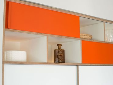 The pops of colour on the cabinet are inspired by the original 1970s design of the kitchen