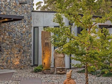Barestone's industrial, textured look contrasts beautifully with the earthiness and irregularity of the Wamberal stonework 