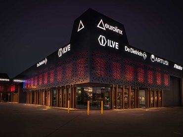 LED lighting behind the facade creates a unique ambience through the perforations at night