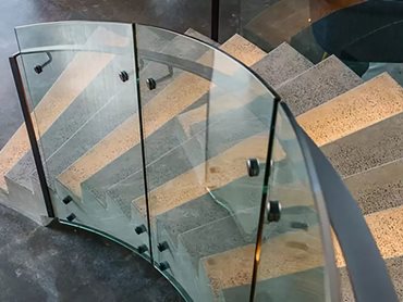 Digital measurements assured an accurate fit and finish of the glass, which married perfectly with the polished concrete staircase