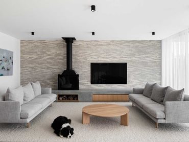 A textured wall of Petersen bricks in the living room 