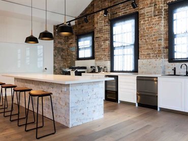 The soft tones of the flooring were a perfect match for exposed raw elements such as brick