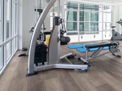 Gym interior with detail of luxury vinyl tile planks