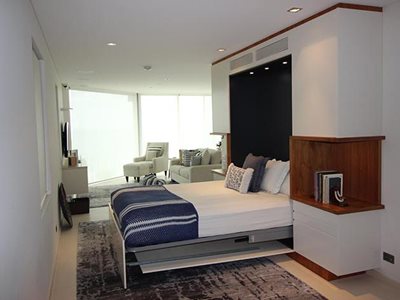 Custom built fold down wall bed with open display veneer cut outs open shot