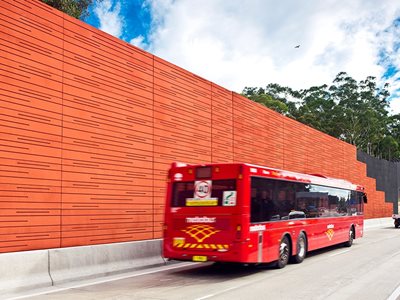 Detailed View of Terracotta Coloured Acoustic Sound Barrier on Highway 