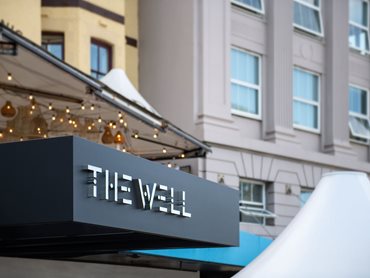 Exterior View of The Well Gym Showing Entrance Signage