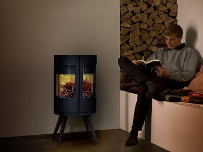 Castworks Morso Cast Iron Heater in Living Room With Man Reading in Corner