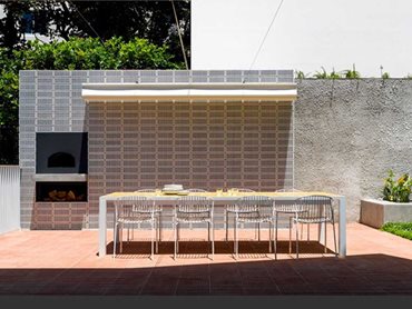 The bespoke breeze brick is perforated to allow light, fresh air and ocean views to filter through the house
