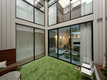 Glass is used to bring in natural light and to capture a sense of space