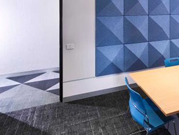 A dynamic carpet pattern with different colours and shapes was used throughout the school