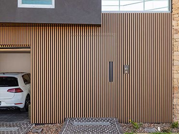 Ever Art Wood timber look battens discreetly concealing the sectional garage door 
