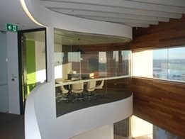 Commercial interiors and exteriors from bent and curved glass