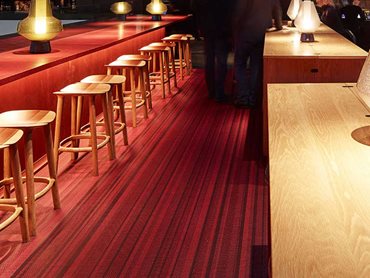 The Lounge features a textured woven flooring from the Bolon by Jean Nouvel Design collection 