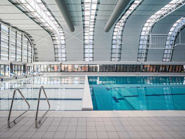 The roof panels' non-corrosive properties ensure performance is not affected by the humid pool environment 