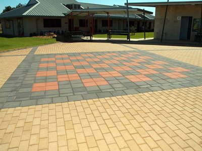Coloured stone pavers outside school building