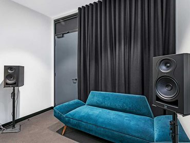 Acoustic blinds and curtains address high reverberation time without diminishing the overall aesthetic