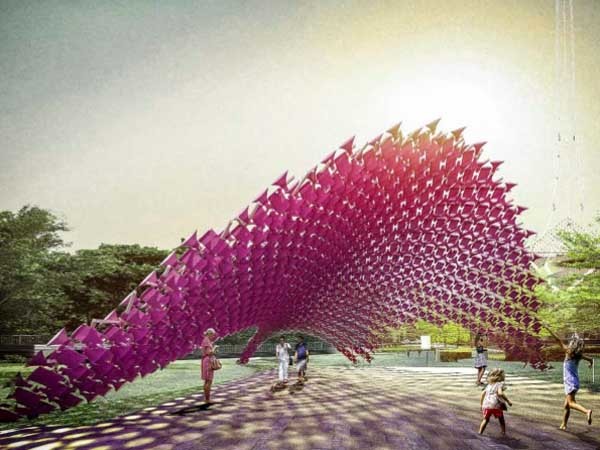 John Wardle Architects’ structure features 3D textile elements individually suspended to create a textural pink skin that provides colourful shade by day and a unique glow by night
