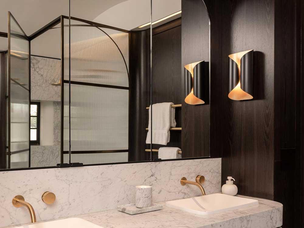 Xilo black veneer turned the bathrooms into hero spaces at the Centennial Park house