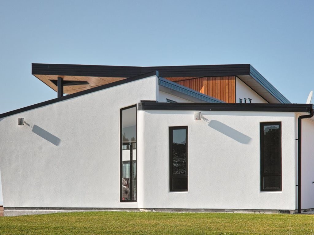 Black Door House, an energy-efficient house designed by Max Capocaccia of MC Architecture Studio. Image: MC Architecture
