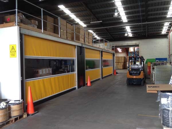 Series RL3000 high speed roll doors were installed under a mezzanine flooring structure
