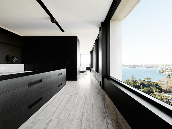 The interior of this apartment was stripped out in its entirety and a new sequence of rooms inserted. A series of linked, but separate, spaces are arranged along the perimeter to maximise access to the water views.