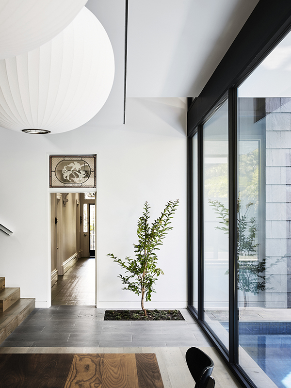 "The connection of dining area to the pool and light drenched void provides a counterpoint to the darker rooms of the existing Victorian house.”